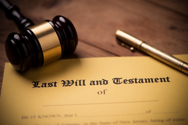 Last will and testament form with gavel. Decision, financial close up