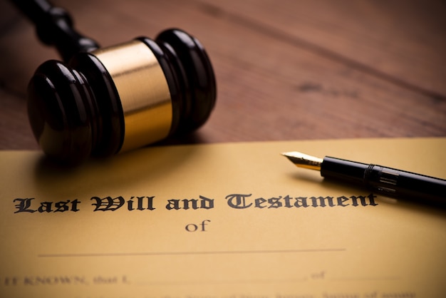 Last will and testament form with gavel. Decision, financial close up