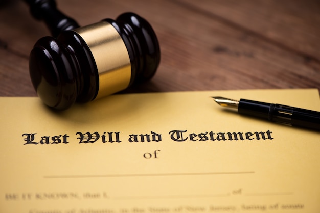 Last will and testament form with gavel. Decision, financial close up