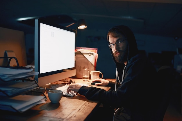 Premium Photo | Late nights are normal for a programmer cropped portrait of  a young computer programmer working late in the office