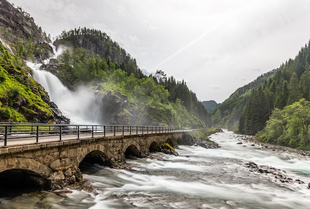 Latefoss waterfalls streams under the stone bridge archs Odda Hordaland county Norway