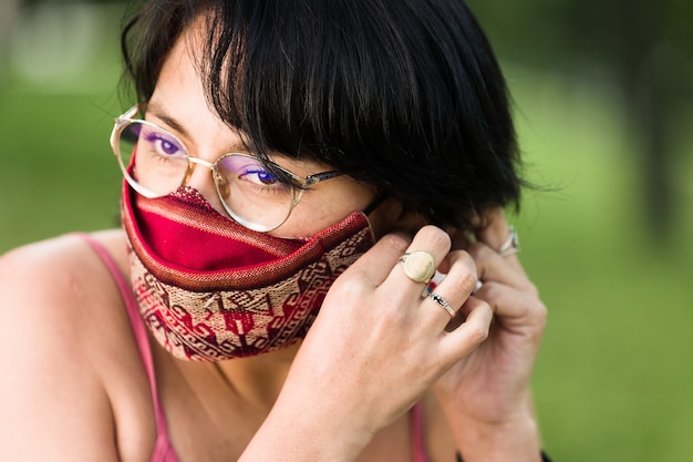 Latin america bolivian woman with traditional pattern cloth\
mask handmade quechua native textile face mask for covid19\
coronavirus protection