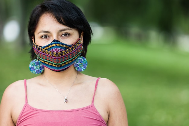 Latin america bolivian woman with traditional pattern cloth\
mask handmade quechua native textile face mask for covid19\
coronavirus protection