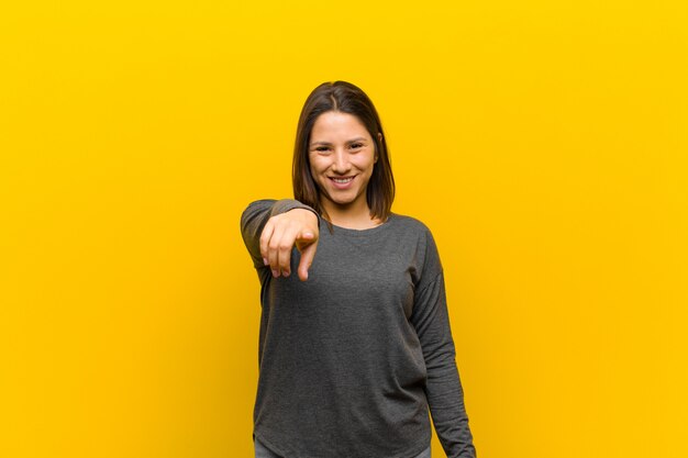 Latin american woman pointing with finger