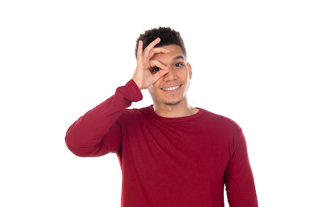 Latin guy with short afro hair isolated on white wall