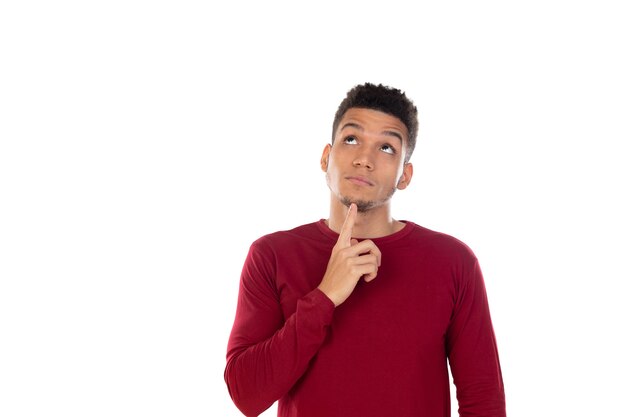 Latin guy with short afro hair isolated on white wall