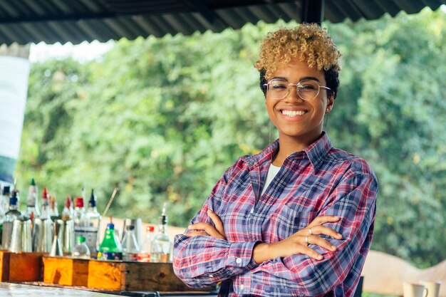 Latin hispanic woman barmaid working at tropical hotel or restaurant