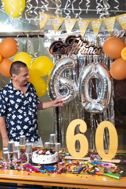 Premium Photo | Latin man celebrating his 60th birthday at home