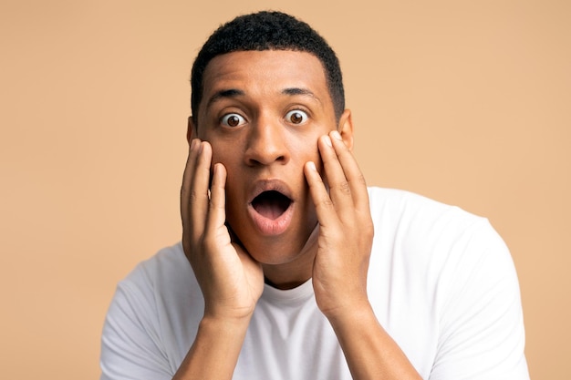 Portrait Of Young Man In Shock With A Scared Face Expression