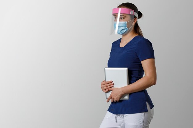 Latin nurse with mask and face shield for pandemic