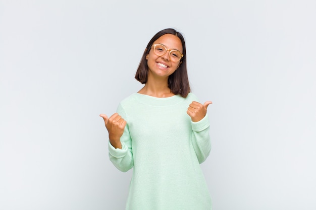 Latin woman smiling joyfully and looking happy