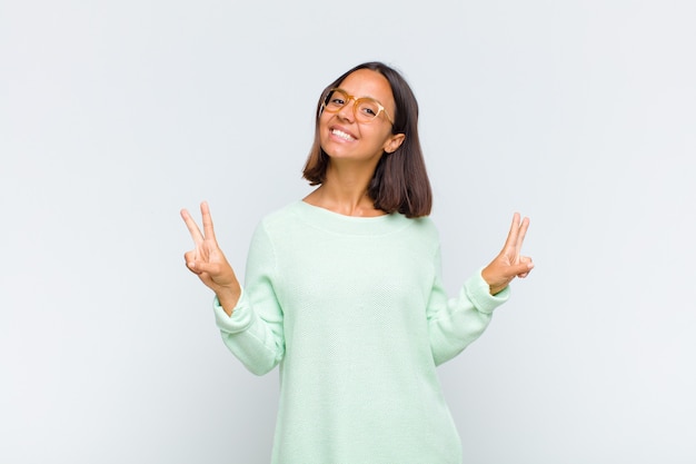 Latin woman smiling and looking happy