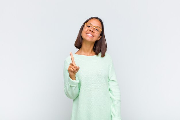 Latin woman smiling proudly and confidently