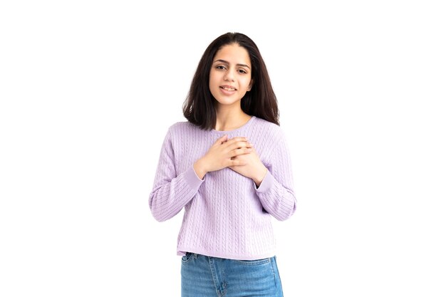 Latin woman with hands over heart