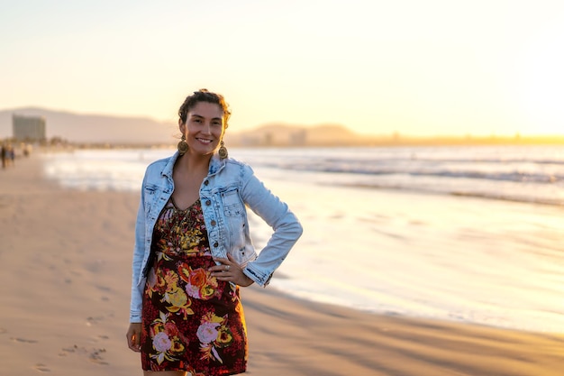 latin young woman on the beach happy smiling, looking at camera, portrait in La Serena