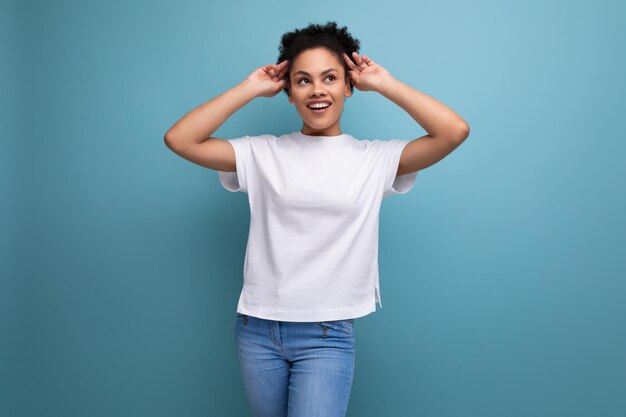 Latin young woman dressed in white tshirt with space for branding