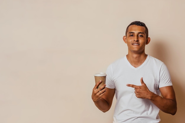 Latinx man pointing finger at coffee cup