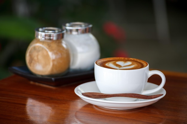 Latte art coffee on wood background