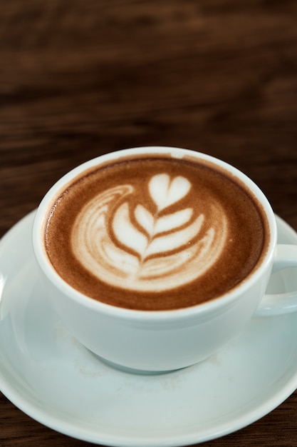 Latte Coffee art on the wooden table