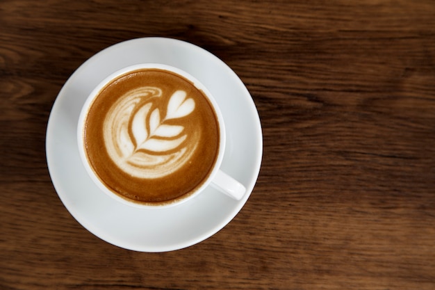 Latte Coffee art on the wooden table