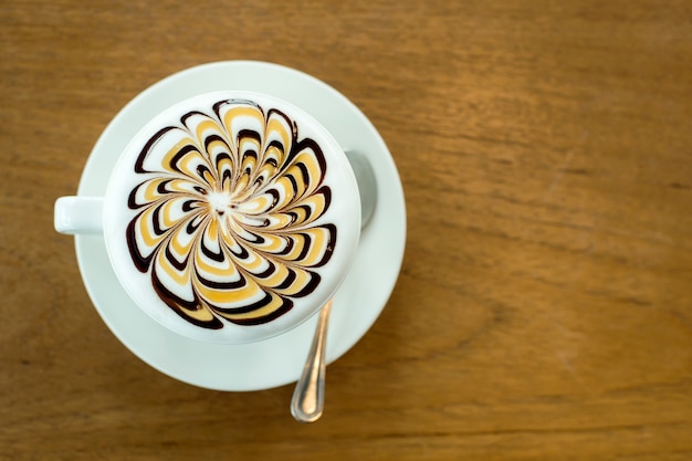 Latte Coffee art on the wooden table