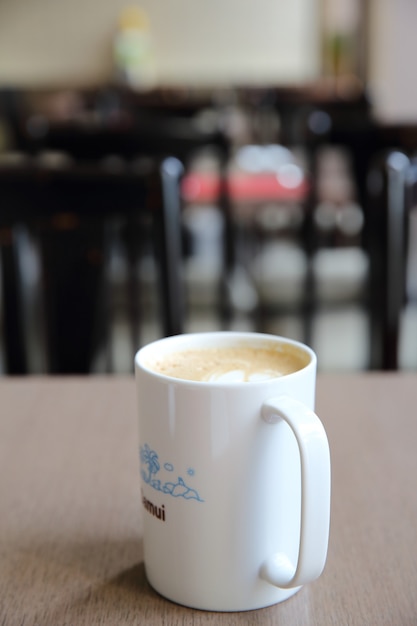 Latte coffee on wood background