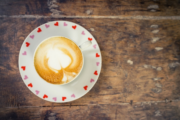 latte coffee on wood table with space