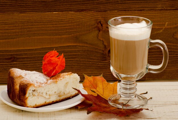 Latte Mug on autumn leaves and apple pie