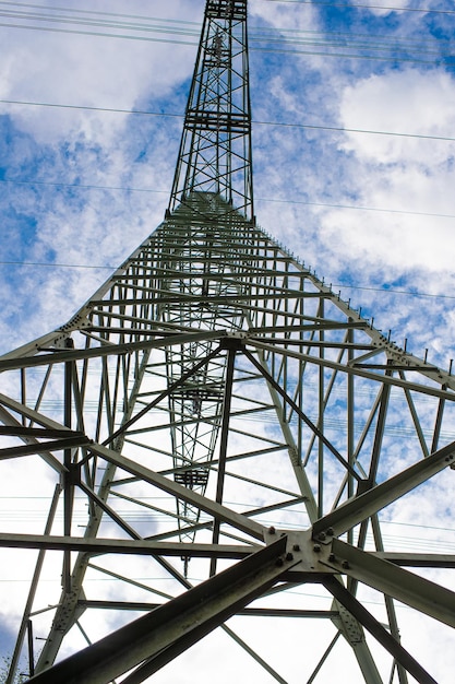 Photo lattice power tower metal structure bottomup in architectural perspective