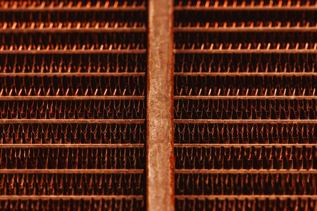 Lattice texture of old rusty radiator with copy space