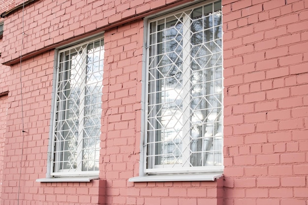 Lattices on windows of red brick building