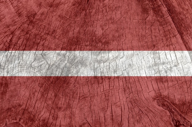 Latvia flag on an old wooden surface