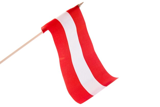 The latvian flag on a white background is developing and flying in the wind