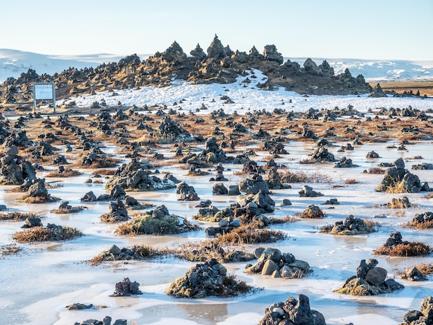 Laufskalavara lava ridge between river surrounded with stone cairns along golden ring road Iceland