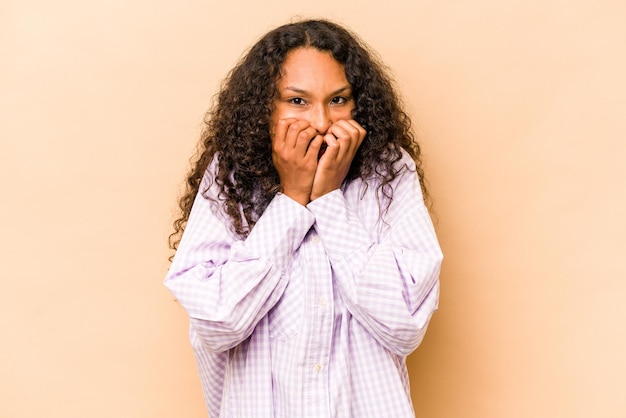 Laughing about something covering mouth with hands