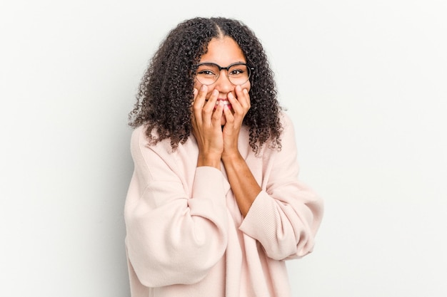 Laughing about something covering mouth with hands