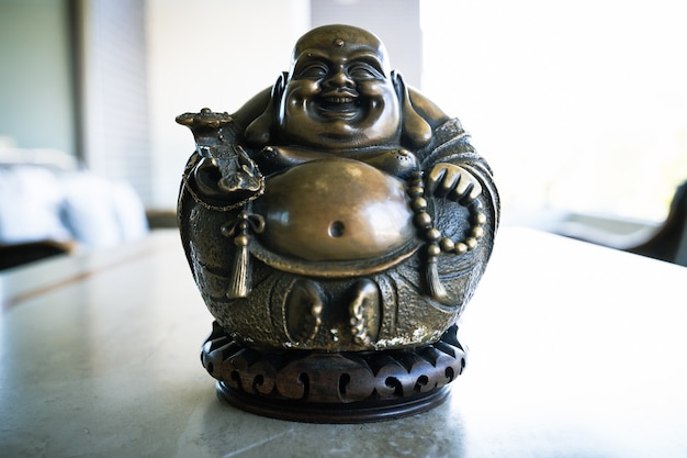 Laughing Buddha of abundance joy and happiness golden color statue Good luck symbol figure decor