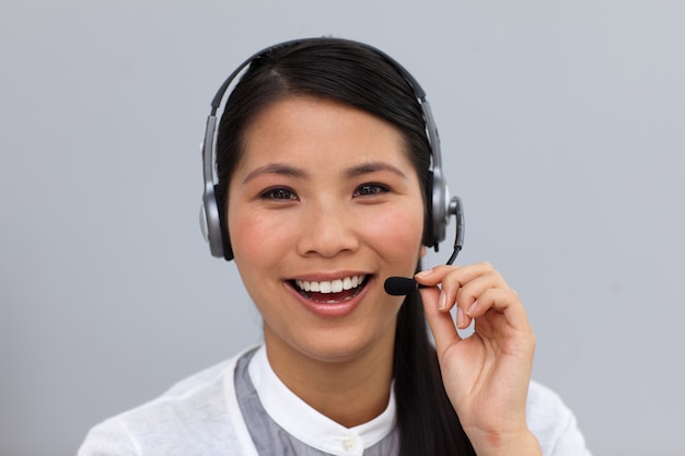 Laughing businesswoman using headset