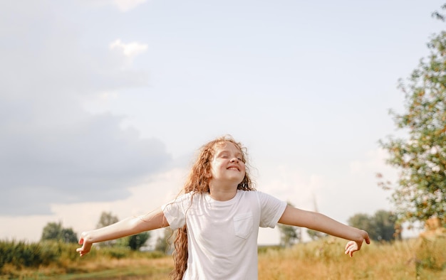 Laughing child enjoy raining day Freedom happy childhood healthy lifestyle