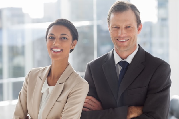 Laughing colleagues in office