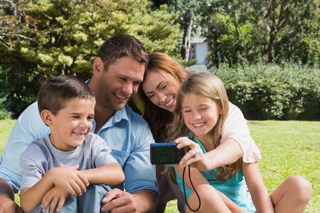 Laughing family looking at a camera