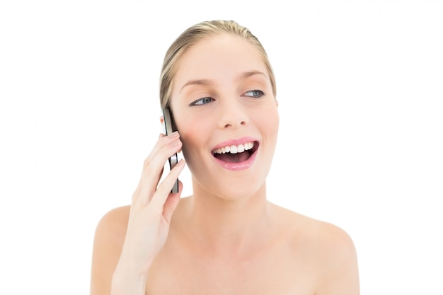 Laughing fresh blonde woman making a phone call