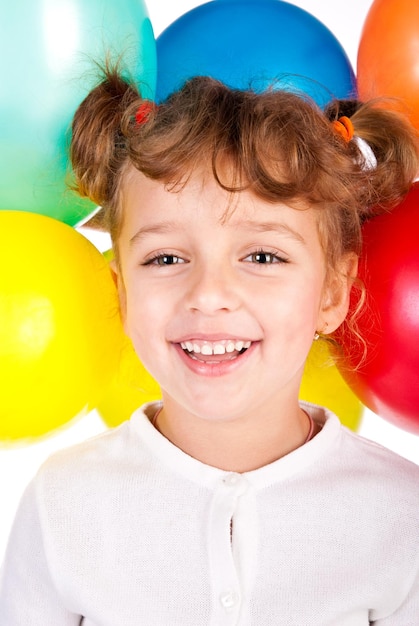 Laughing girl with color balloons
