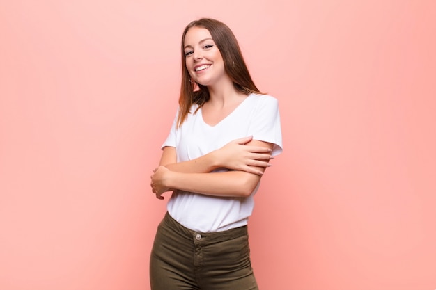 laughing happily with arms crossed, with a relaxed, positive and satisfied pose