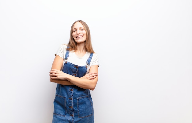 laughing happily with arms crossed, with a relaxed, positive and satisfied pose