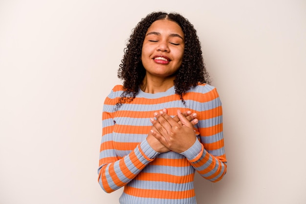 Photo laughing keeping hands on heart concept of happiness