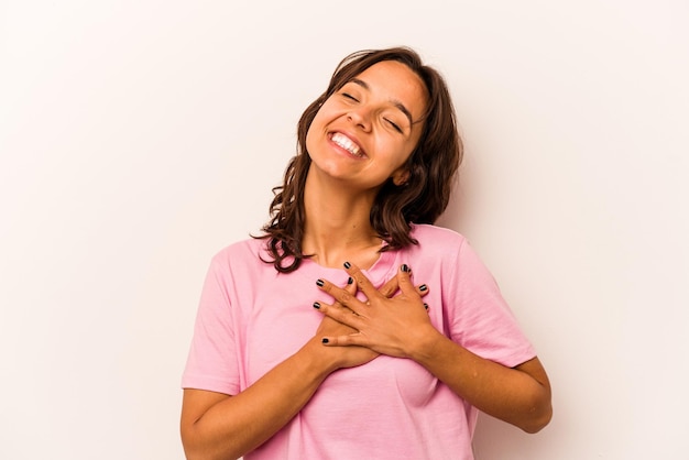 Laughing keeping hands on heart concept of happiness