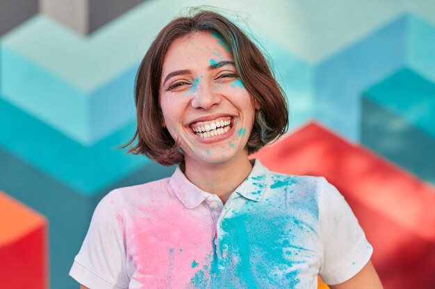 Laughing woman with paint on her face