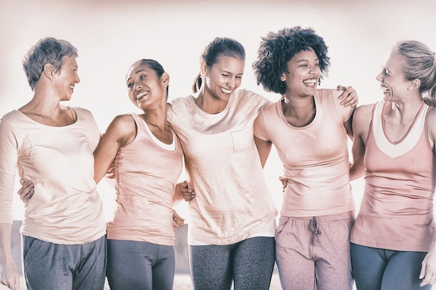 Photo laughing women wearing pink for breast cancer