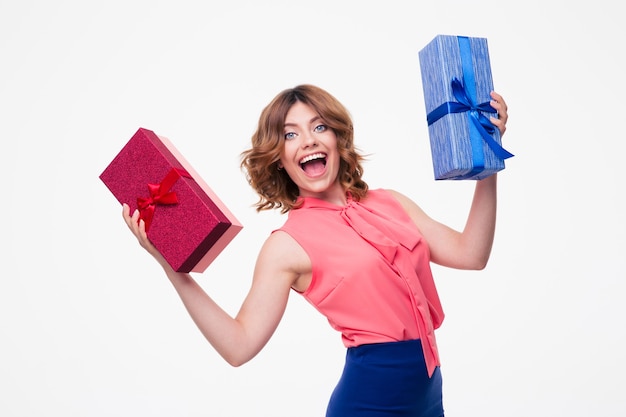 Laughing young woman holding gifts